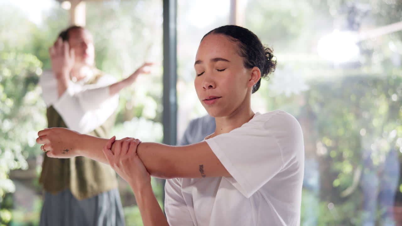 Woman Stretching in a Group Class