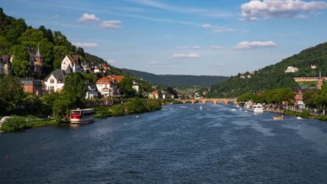 panoramic panning time lapse of heidelberg city landmarks and river traffic