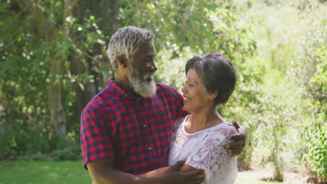 Happy-senior-couple-hugging-each-other-