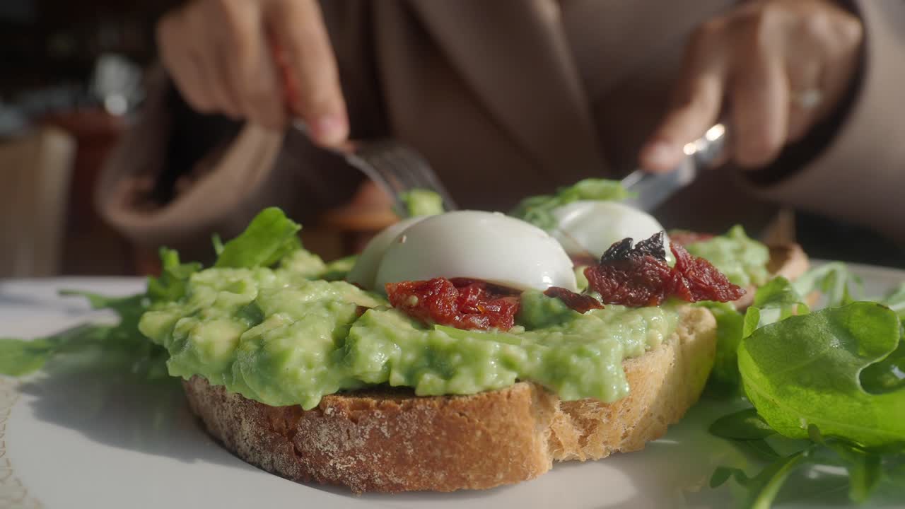 Eating Healthy Avocado Toast with Poached Egg