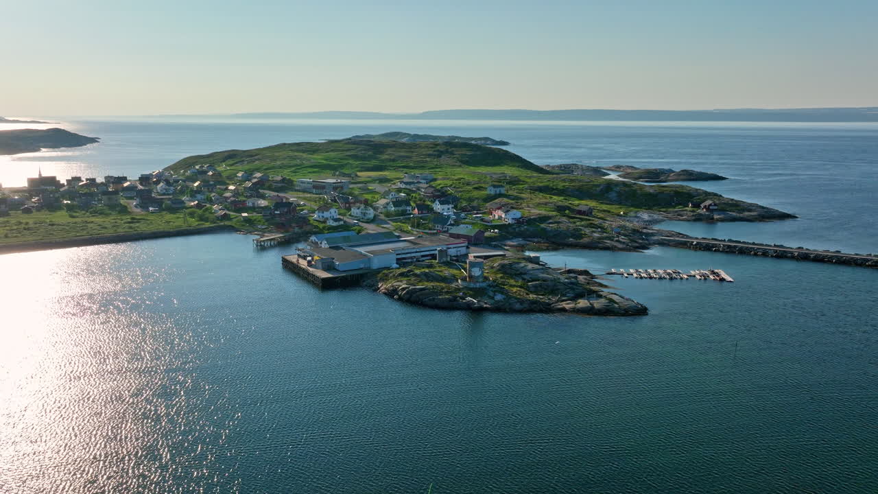 Drone circling King Crab Production facilities in Pykeija, sunny day in Norway