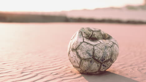 single ball on the beach with nobody