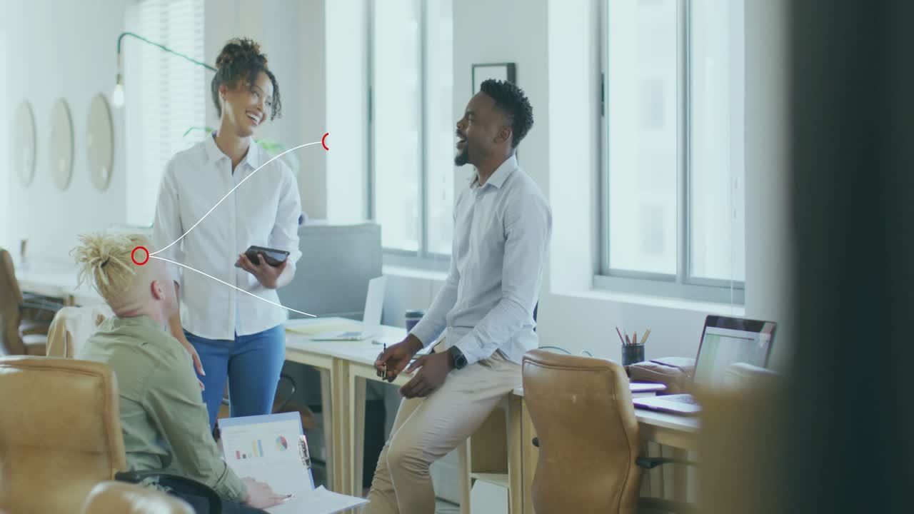 Female colleague tapping tablet screen and sparking data review in business meeting with colleague