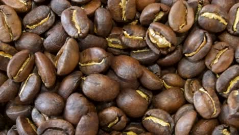 slow-motion-shot-of-freshly-roasted-coffee-beans