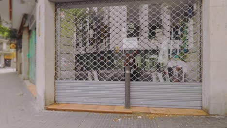 shop closed due to the covid-19 coronavirus pandemic in spain goes out of business day wide shot