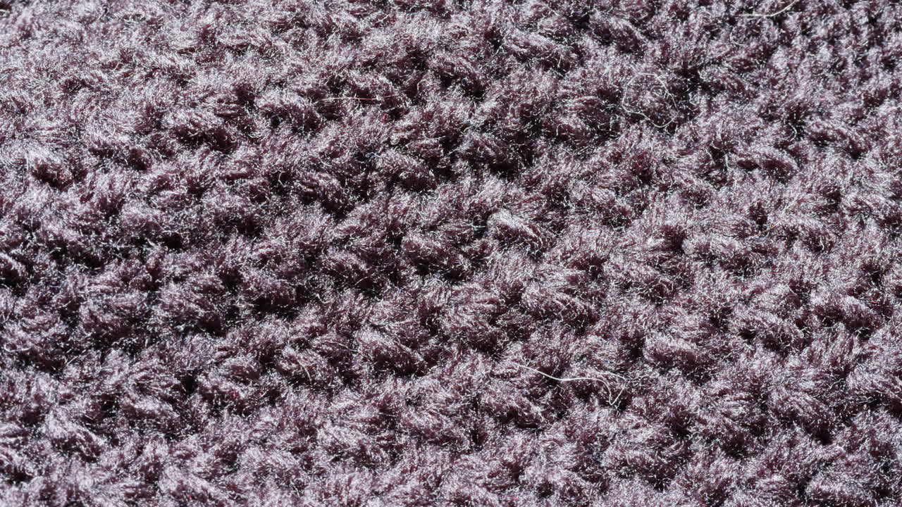 Close-up of Dark Knitted Fabric Texture