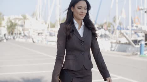 Woman-Walking-Along-The-Quay-With-Yachts