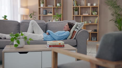 woman relaxing on a couch in a living room