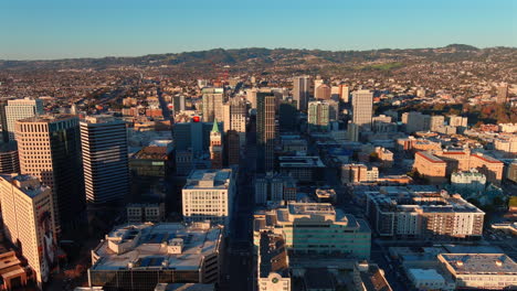 oakland, california city skyline at sunset - sliding aerial reveal