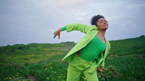 Woman-choreographer-dancing-outdoor-at-cloudy-field.-Girl-performing-vertical