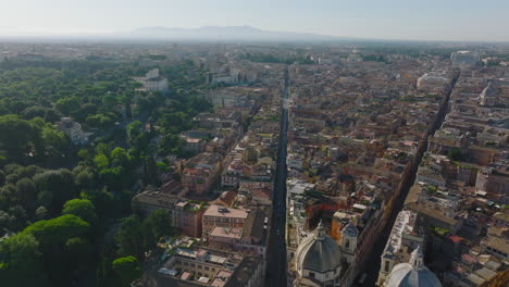 Aerial-panoramic-view-of-historic-city-centre.-Forwards-fly-above-Via-del-Babbino,-famous-shopping-street.-Rome,-Italy