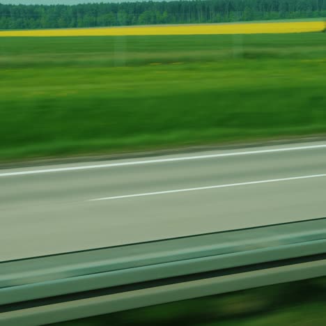 Wide-Highway-And-Green-Fields