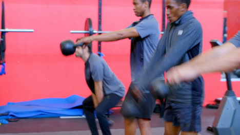 athletes exercising with kettlebell 4k