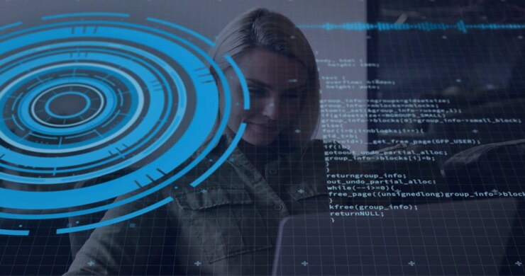 Female tech developer typing at laptop reviewing code while blue HUD overlapping and scrolling code