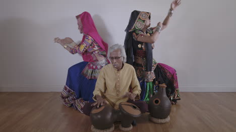 indian percussion musician with dancers 07