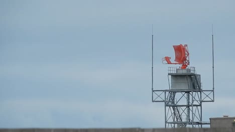 air traffic control radar tower rotating across welsh valley airport in holyhead