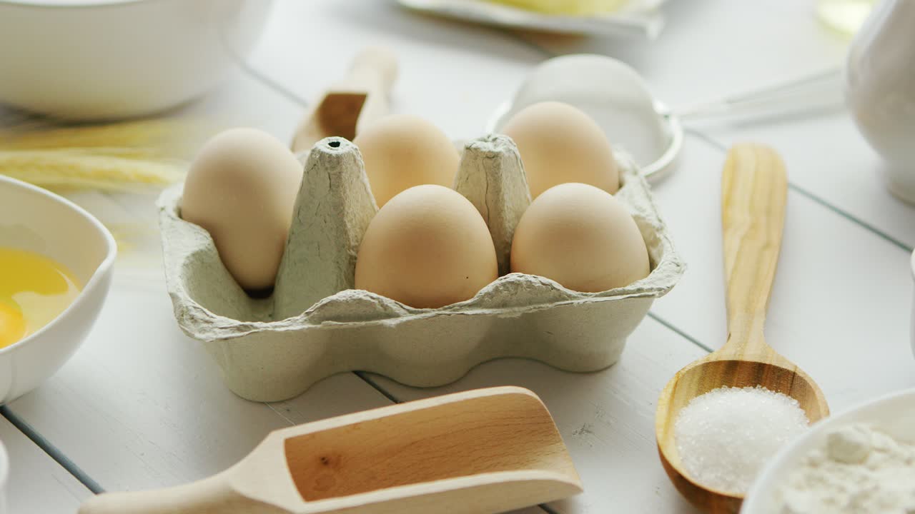 Cooking ingredients and tools around eggs