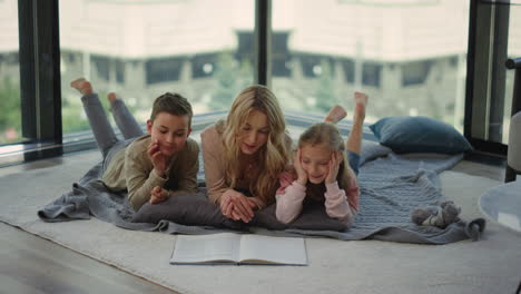 Mom-reading-book-siblings-at-home.-Mother-spending-time-with-daughter,-son.