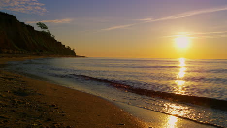 Mountain-hill-silhouette-at-evening-coastline.-Summer-beach-landscape-sunset