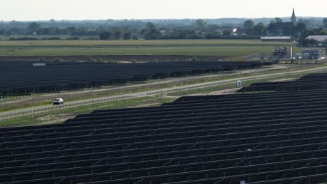 aerial panoramic view of huge base station plant farm of solar panel in countryside