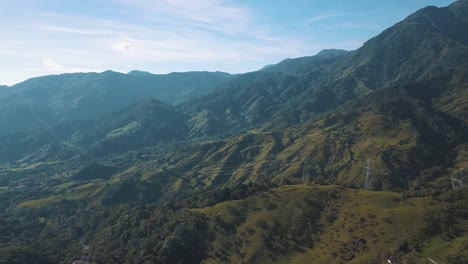 landscape view of green mountains and hills in colombia - drone aerial shot