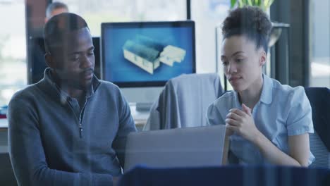 young man and woman working on computer