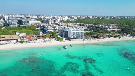 beachfront hotels and turquoise sea in playa del carmen, mexico, sunny aerial view