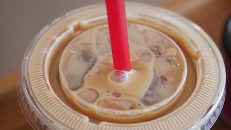 iced coffee in a plastic cup with straw