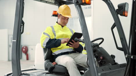 tablet, industrial and forklift with man