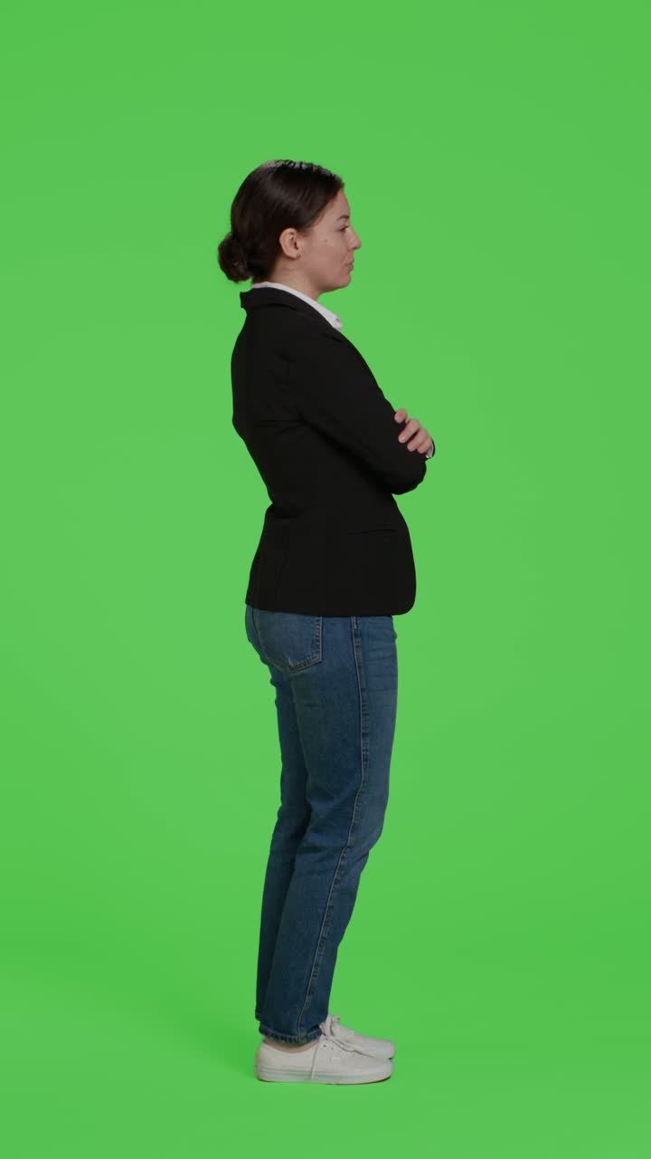 Vertical video: Profile of young businesswoman acting confident wearing suit