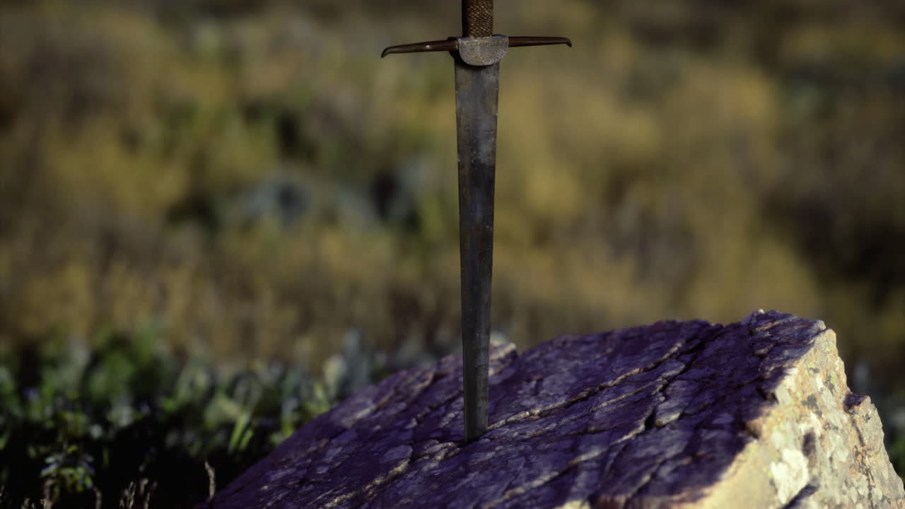 Sword embedded in rock at sunset amidst natural landscape