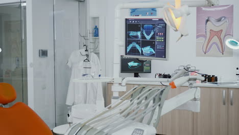 Close-up-revealing-shot-medical-dentistry-display-with-teeth-diagnosis-xray
