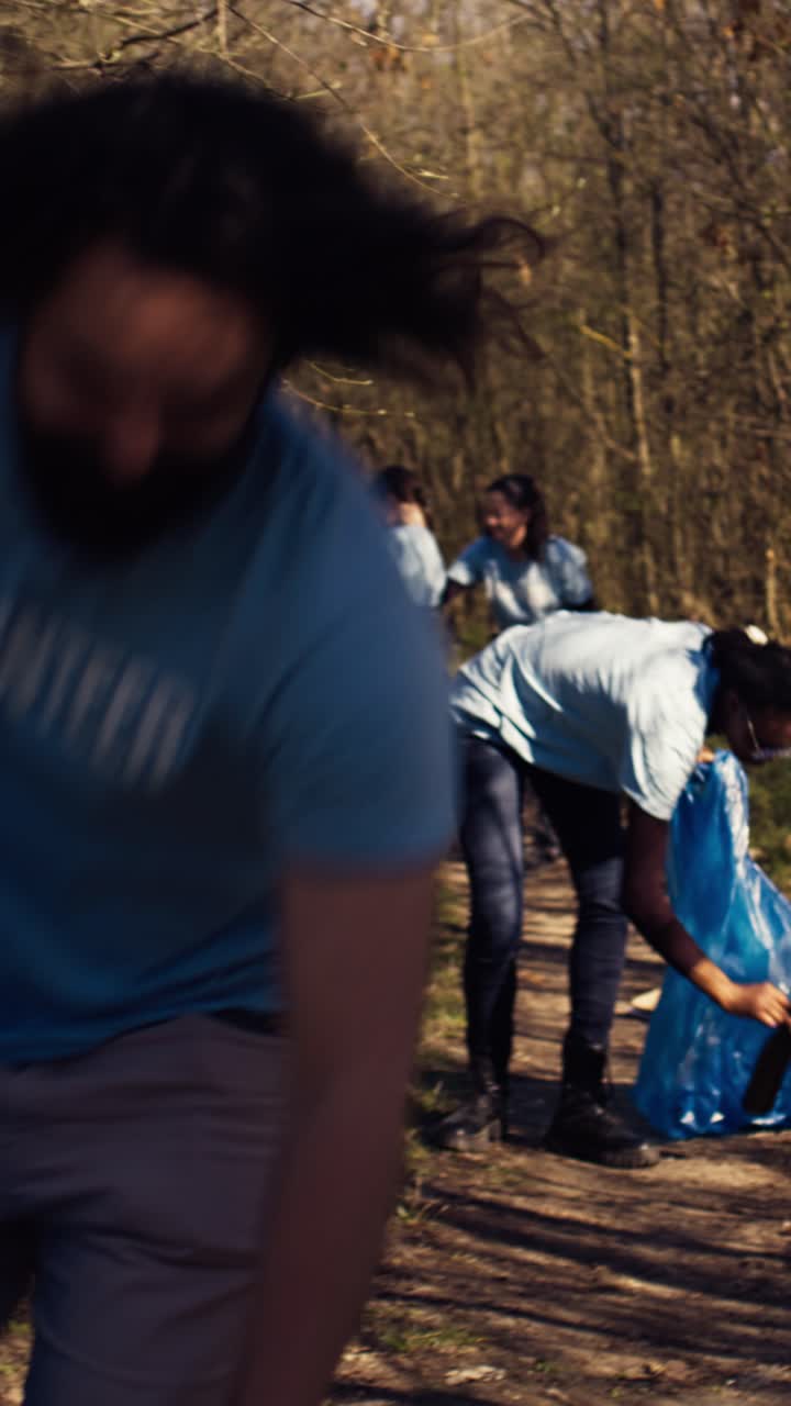 Group of Volunteers Cleaning Up Litter in a Forest
