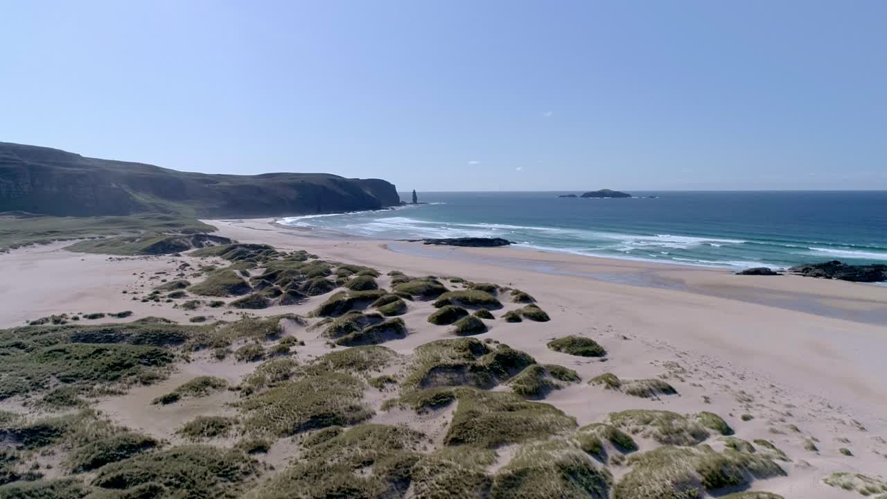 Rotating aerial arcing from south to north of the amazing remote Sandwood Bay, Sutherland, Scotland