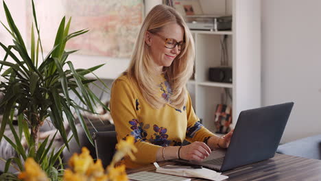 woman working on a laptop at home