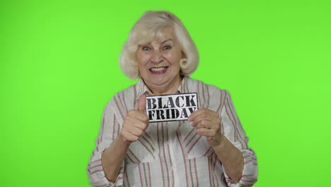 Great-discounts-for-grandparents.-Elderly-grandmother-woman-showing-Black-Friday-inscription-banner