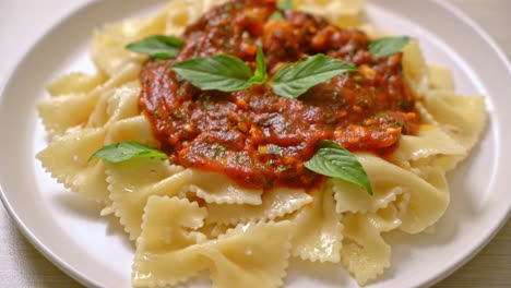 farfalle-pasta-with-basil-and-garlic-in-tomato-sauce---Italian-food-style