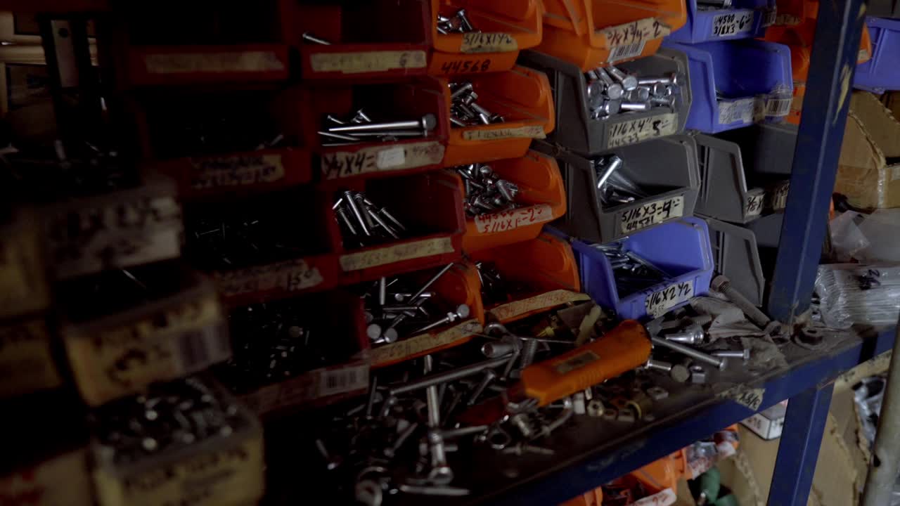 Close-up of Hardware Fasteners in Workshop Storage Bins