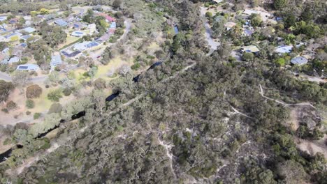 Drone-aerial-panning-up-from-a-river-system-to-the-beach-of-Victor-Harbour