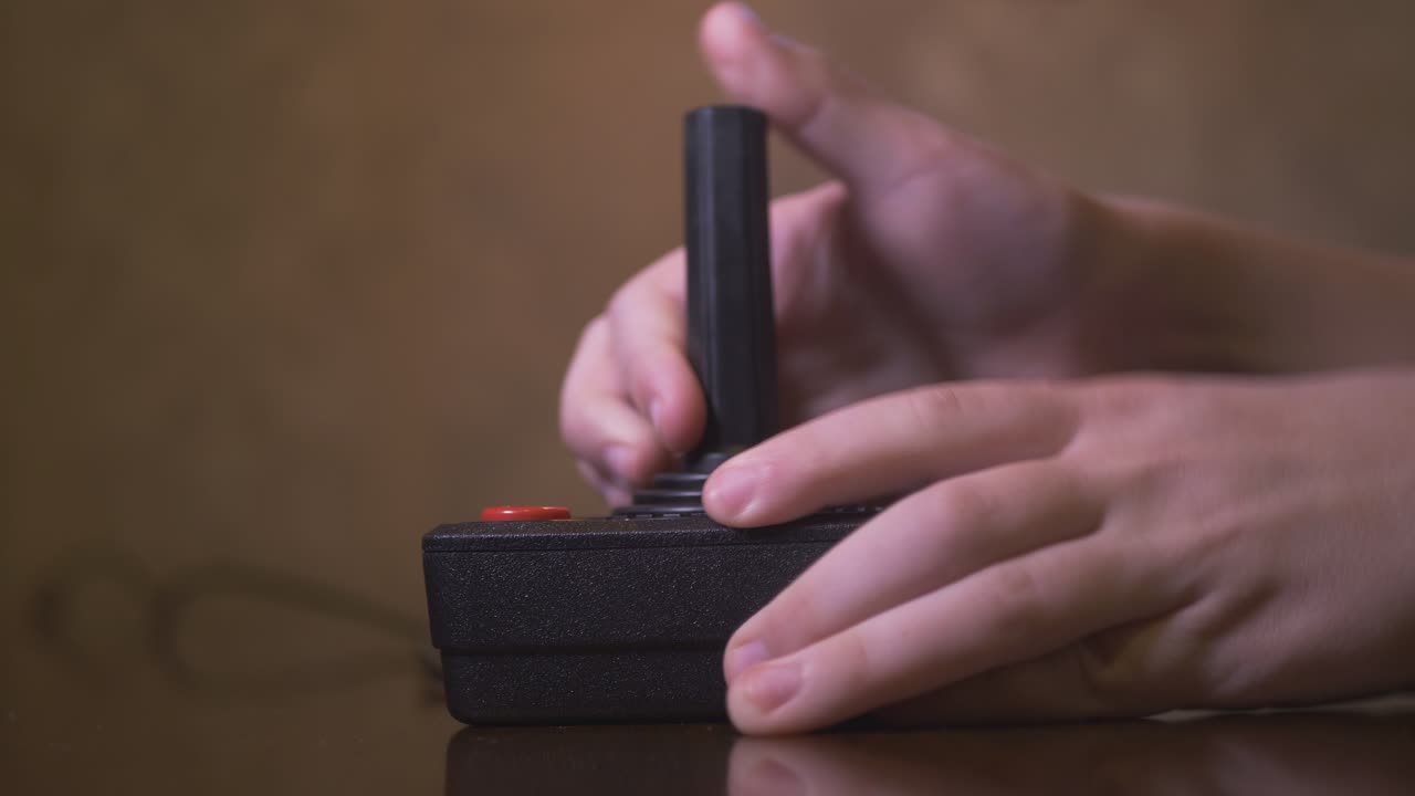 Child Playing With Vintage TV Video Game Joystick. 4K Footage