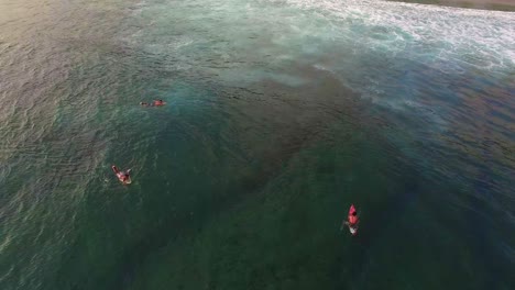 Flying-Over-Surfers-in-Turquoise-Blue-Waters