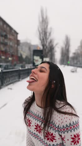 woman enjoying a snowy day in the city