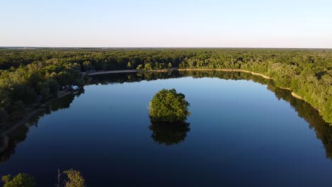 mirror smooth lake during sunset, golden hour