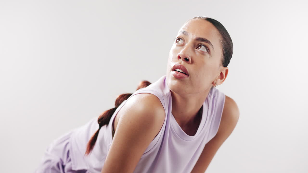Tired Young Woman Sweating After Intense Workout in Studio