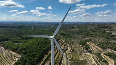 cinematic view of wind turbines blades rotating at