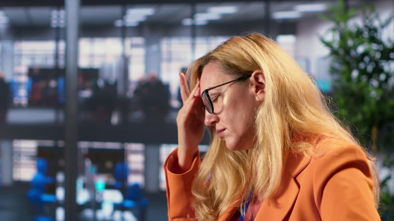 Woman experiencing stress in the office