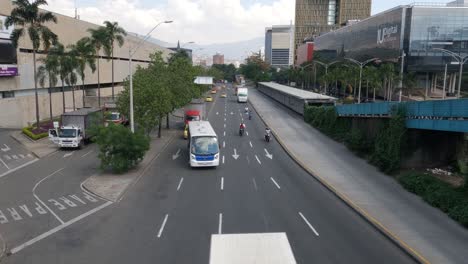 medellin, colombia. downtown avenue traffic, view from pedestrian overpass bridge 60fps