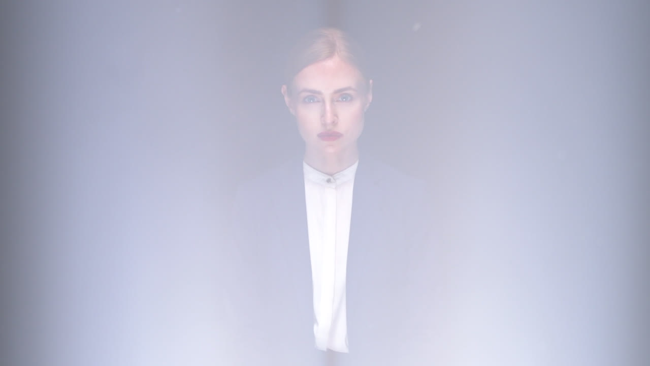 Stunning portrait of a young business woman using parallel beam lighting for effect