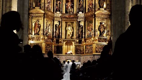 two people getting married in a church unrecognizable