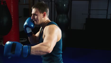 a young boxer practices punches on a punching bag 1